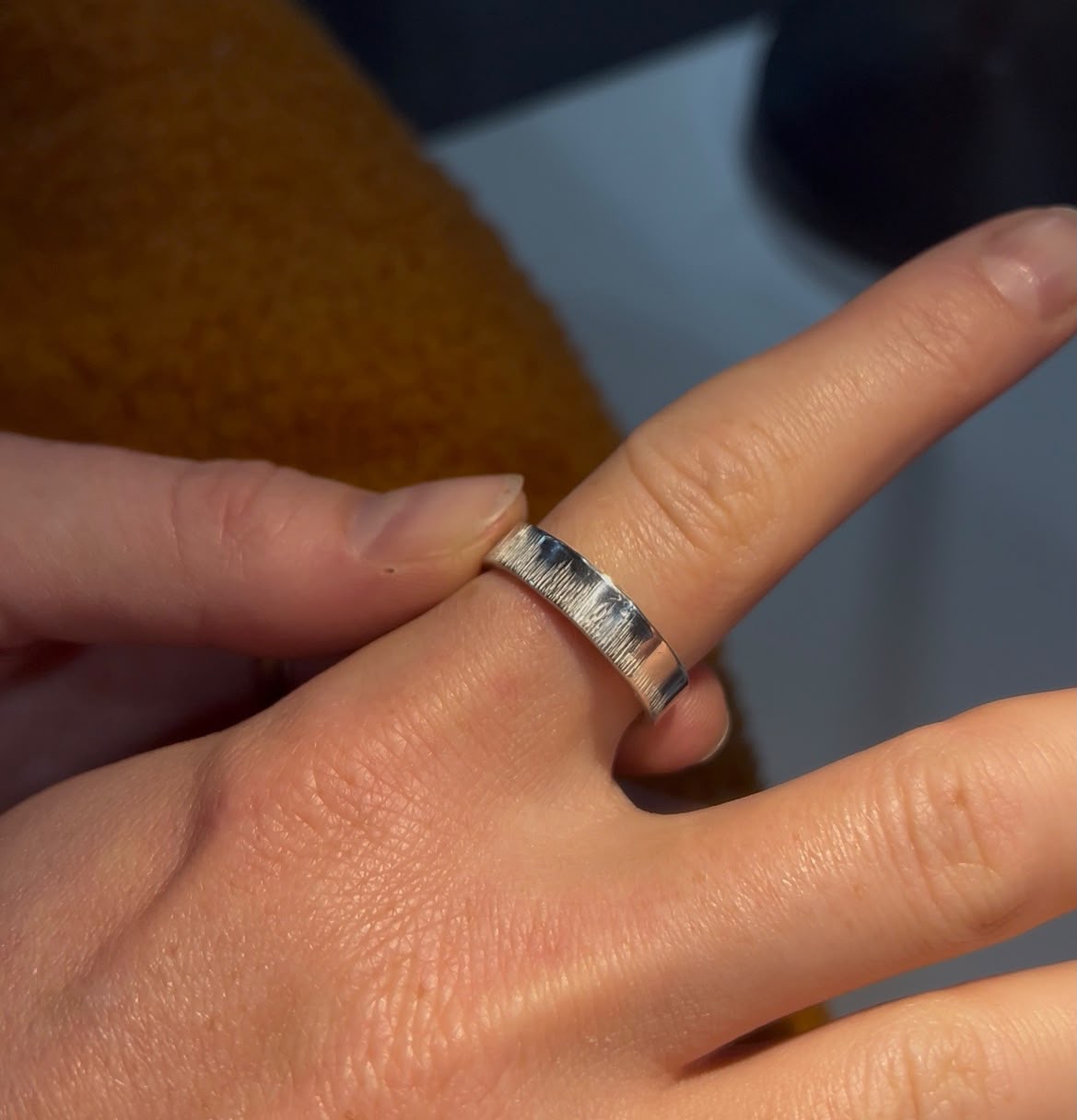 Close-up of a textured silver ring